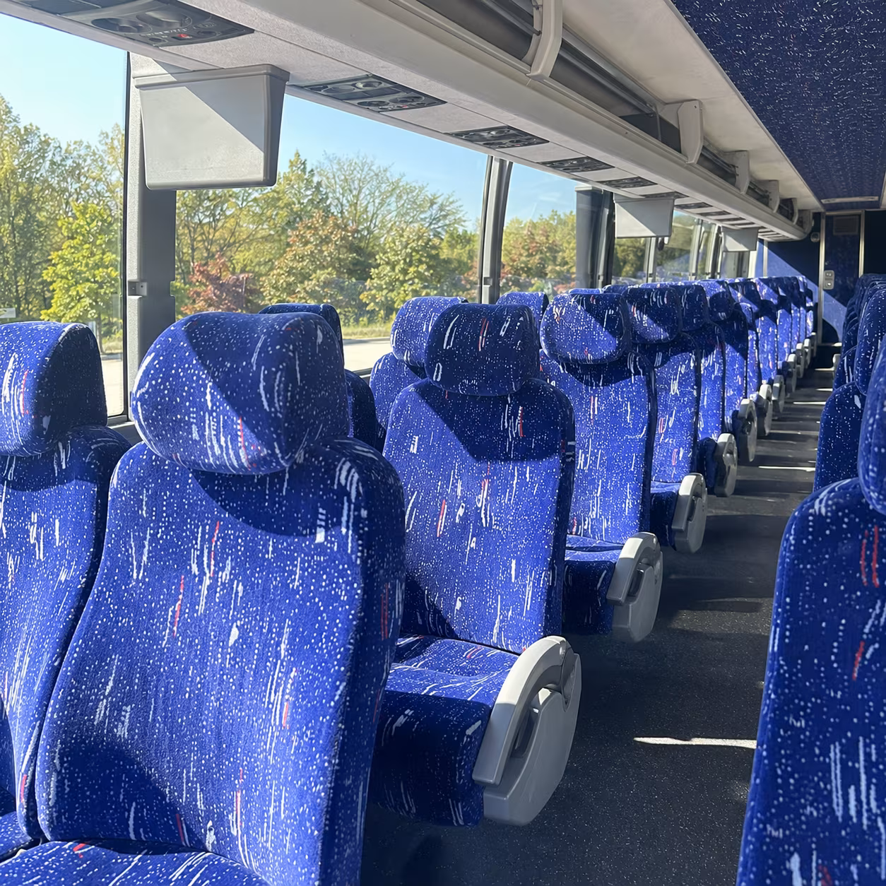why flint fan groups choose charter buses over driving to detroit